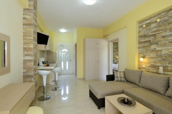 Superior Apartment, 1 Bedroom | Living area | 21-inch flat-screen TV with satellite channels, TV