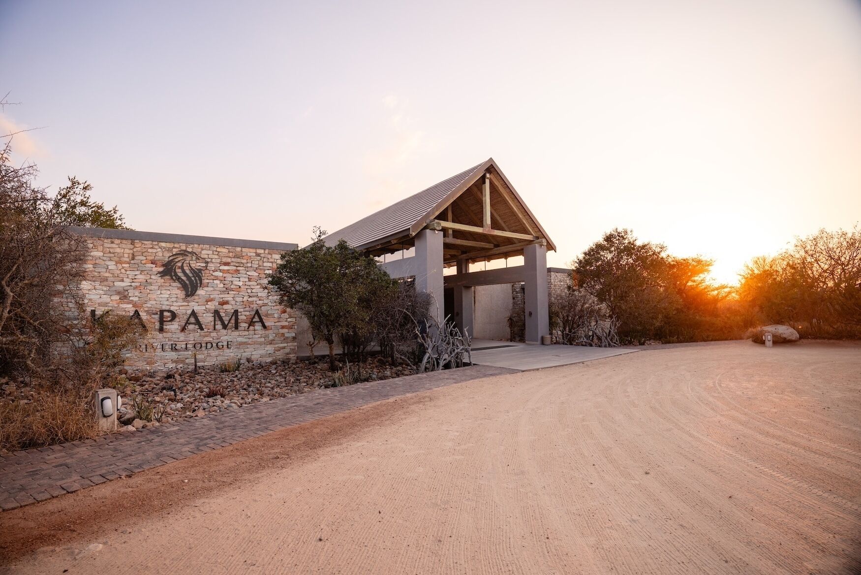 A building with a stone facade and a covered entrance.