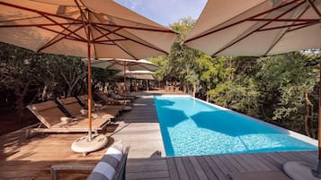 Outdoor pool, pool umbrellas, sun loungers