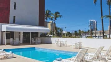 Outdoor pool, open 9 AM to 10 PM, pool loungers