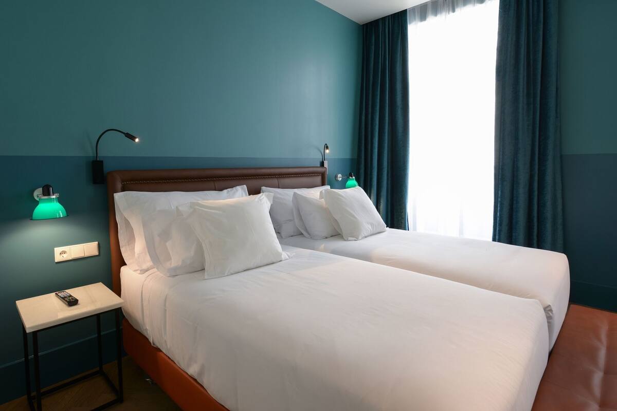 Premium bedding, down comforters, minibar, in-room safe