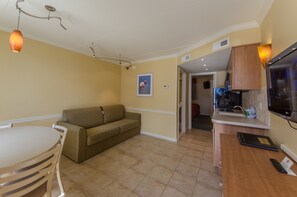 Standard Suite, 1 Bedroom, Pool View | Living area | 55-inch flat-screen TV with satellite channels, TV