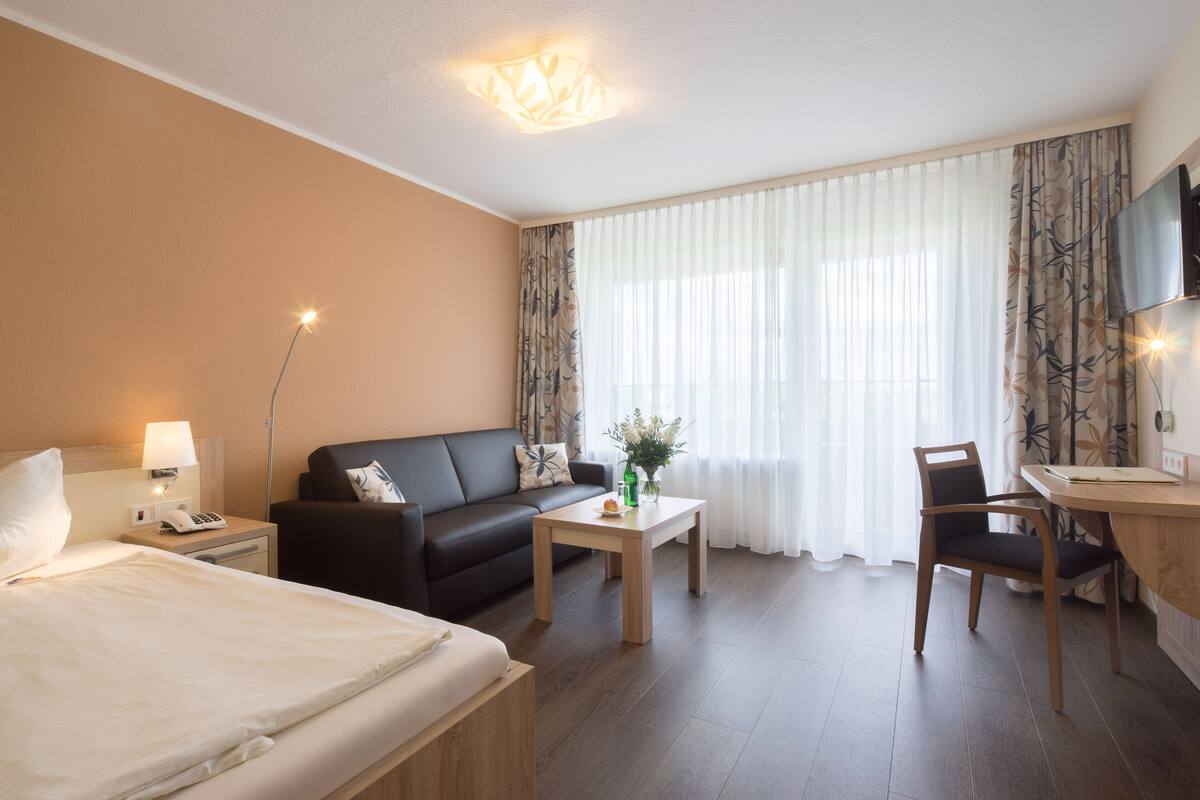 Habitación individual Confort | Ropa de cama de alta calidad, minibar, escritorio y cunas gratuitas