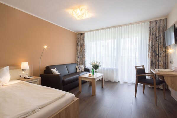 Habitación individual Confort | Ropa de cama de alta calidad, minibar, escritorio y cunas gratuitas