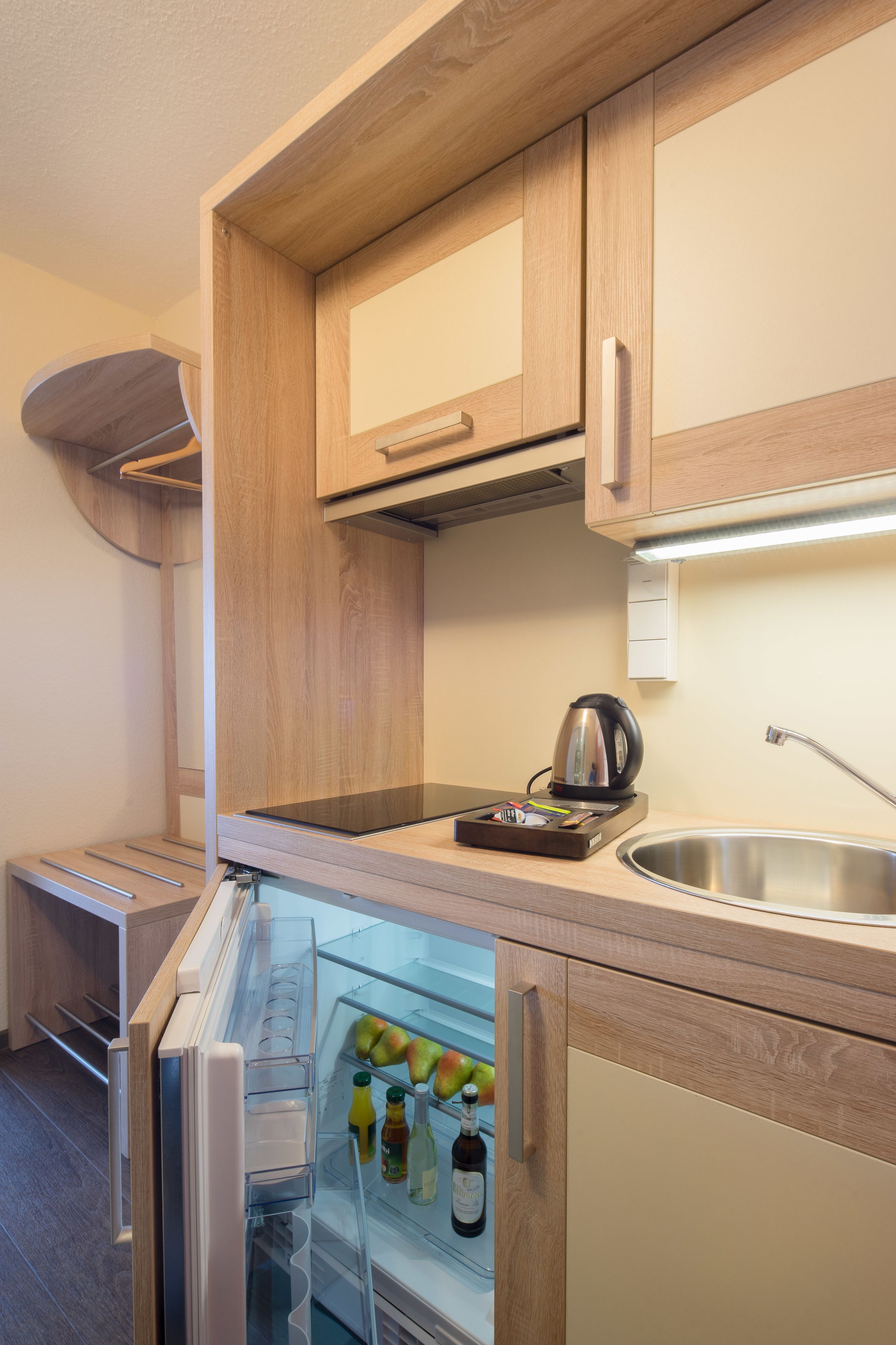 full-sized fridge, stovetop, coffee/tea maker, cookware/dishes/utensils