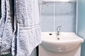 A bathroom with a sink and a towel rack. - Villa Brksi (Split)