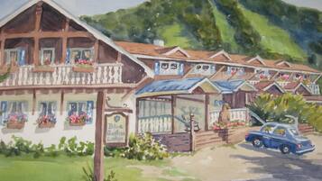 A row of traditional chalet-style buildings with balconies, a sign reading "Blue Berline Lodge," and a parked car in front.