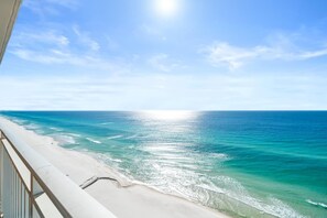A beach view with clear skies and calm waters. - Splash Beach Resort by Panhandle Getaways (Panama City Beach)