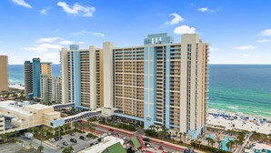 A high-rise hotel with multiple floors, a beach view, and a swimming pool. - Majestic Beach Resort by Panhandle Getaways (Panama City Beach)