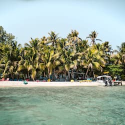 On the beach, white sand, sun-loungers, snorkelling