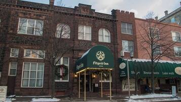 A brick building with a green awning labeled 'Fitzgeral's Inn Office.'