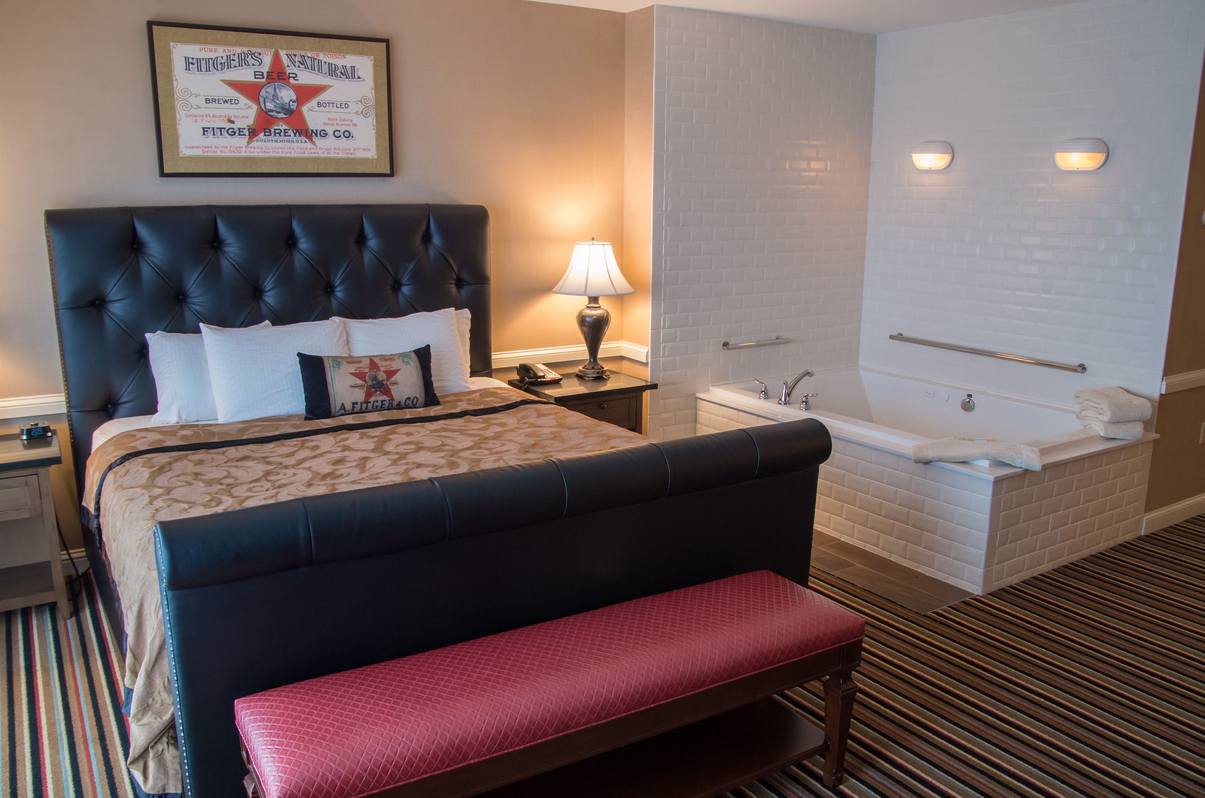 superior suite, 1 king bed with sofa bed, jetted tub, lake view | in-room safe, desk, iron/ironing board, free wifi