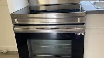 Room, 1 Queen Bed | Private kitchen | Fridge, microwave, oven, coffee/tea maker