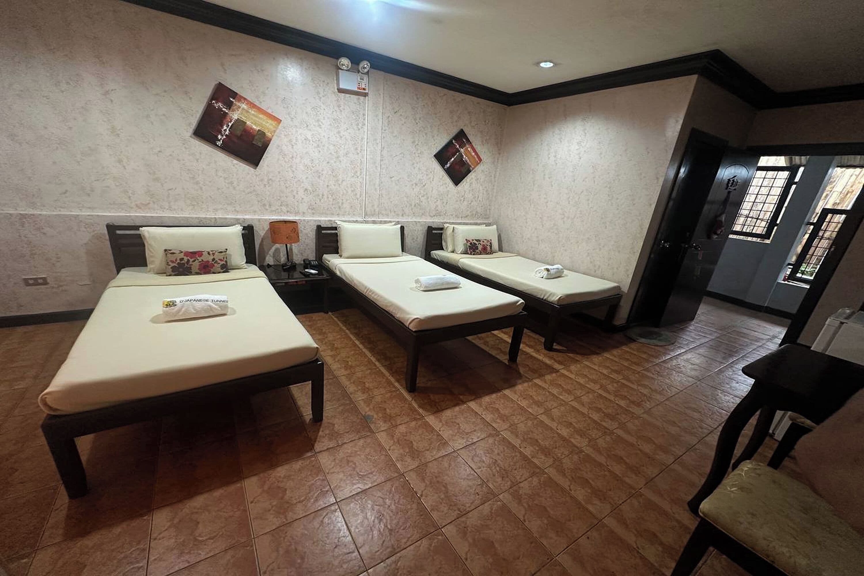 Standard Triple Room | Desk, blackout curtains, iron/ironing board, rollaway beds
