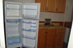 Apartamento, 2 quartos | Cozinha privada | Geladeira, cooktop