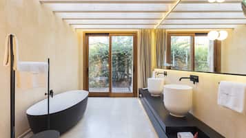 Garden Deluxe | Bathroom | Designer toiletries, hair dryer, bathrobes, slippers