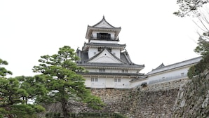 A traditional Japanese castle with a prominent multi-tiered tower, stone walls, and surrounding greenery. - Orient Hotel Kochi (Kochi)