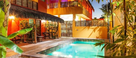 Outdoor pool, a heated pool, open 9:00 AM to 8:00 PM, pool loungers