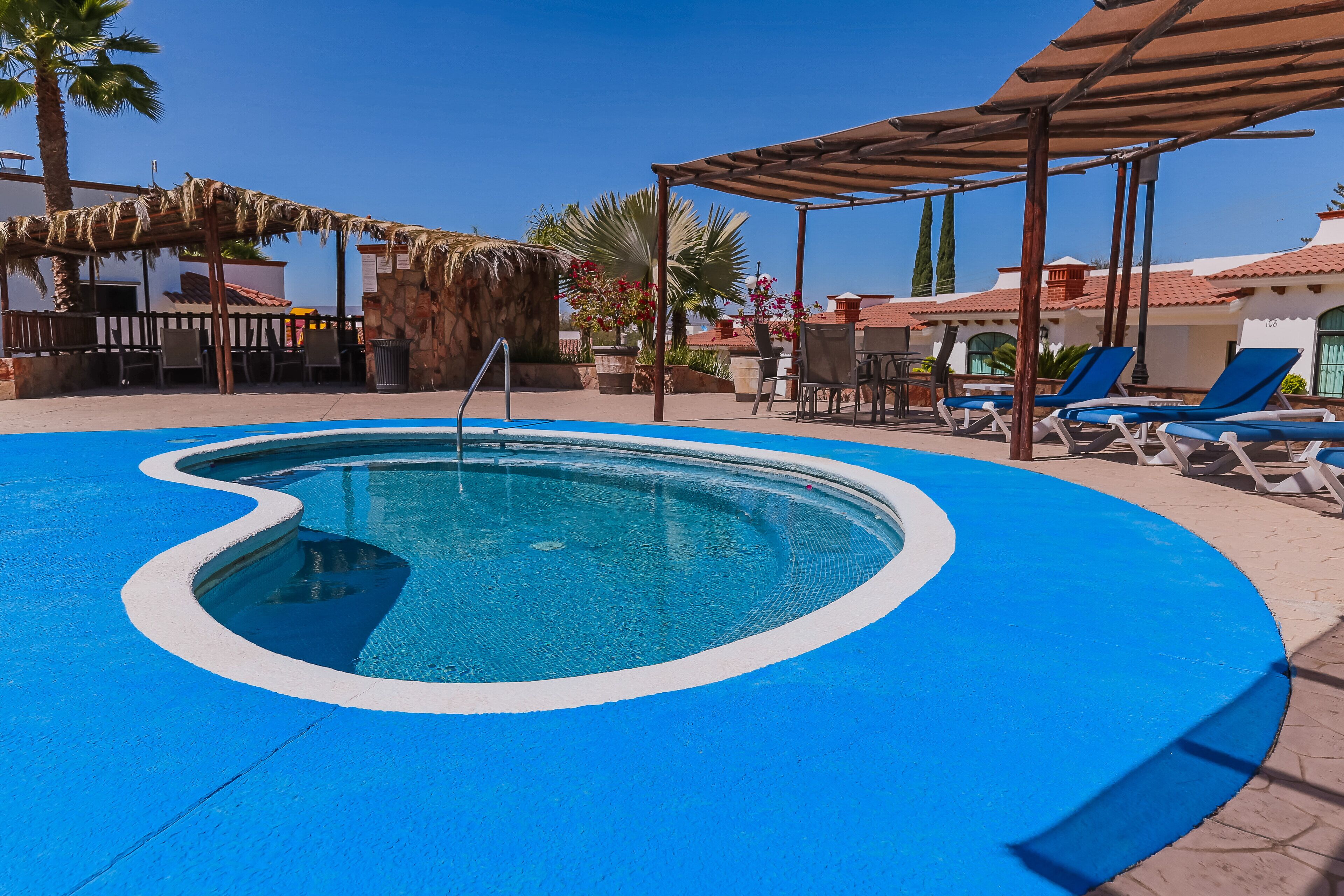 2 outdoor pools, pool umbrellas, pool loungers