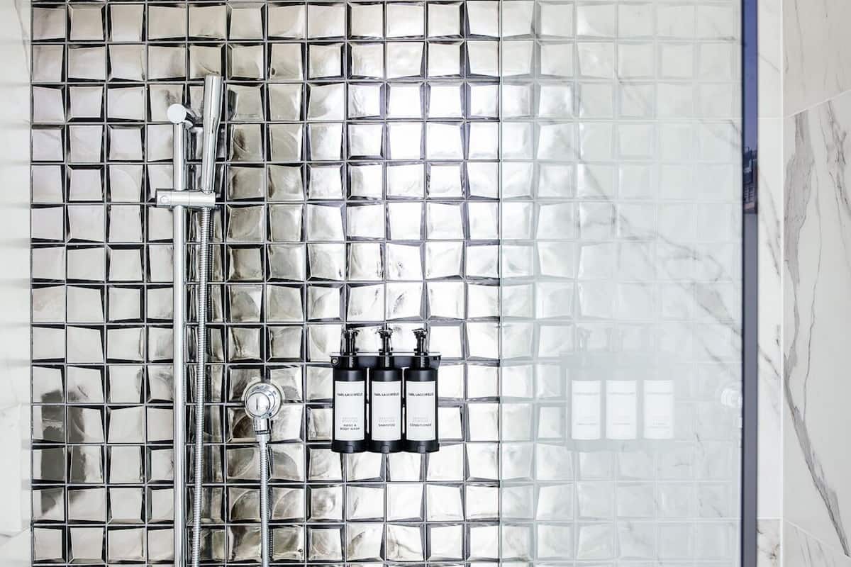 Shower, rainfall showerhead, designer toiletries, hair dryer