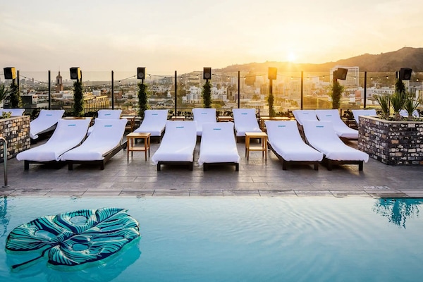 Outdoor pool, open 8:00 AM to 7:00 PM, cabanas (surcharge)