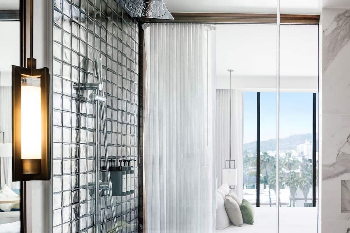 Shower, rainfall showerhead, designer toiletries, hair dryer