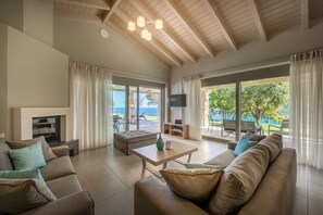 Deluxe Villa, 3 Bedrooms, Private Pool, Sea View | Living room | 42-inch flat-screen TV with satellite channels, plasma TV, fireplace - Artina Luxury Villa (Zakynthos)