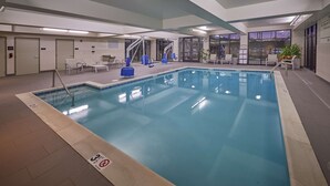 An indoor swimming pool with clear lane markings, a lifeguard chair, and a no diving sign. - Hampton Inn & Suites Hood River (Hood River)