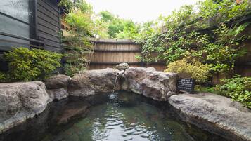Shower, hair dryer, slippers, towels