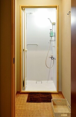 Shower, free toiletries, hair dryer, slippers