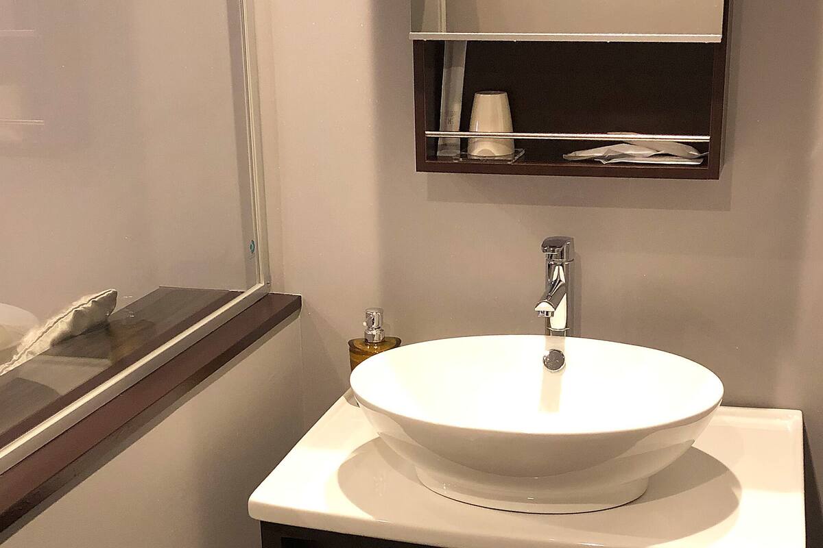 single room (no bathroom in the room. please use large public bath on 8th floor) | bathroom | combined shower/bathtub, hydromassage showerhead, free toiletries