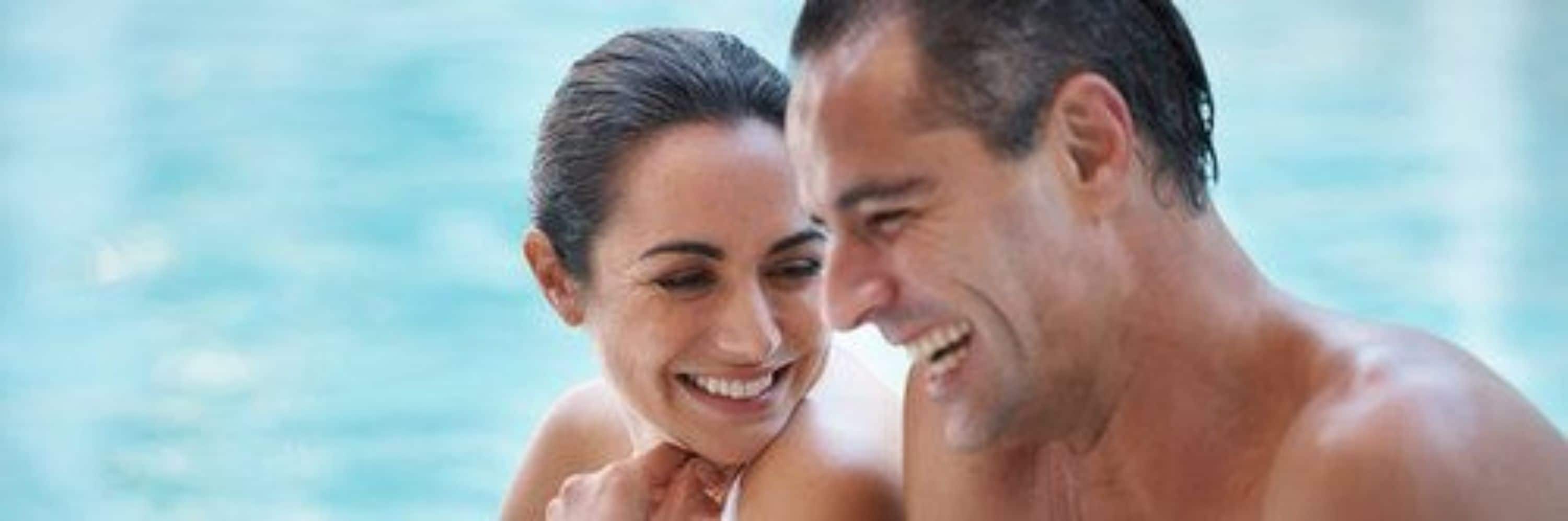 A man and a woman in a swimming pool.