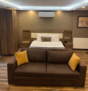 Junior Double Room, Kitchenette, City View | 1 bedroom, in-room safe, blackout curtains, iron/ironing board
