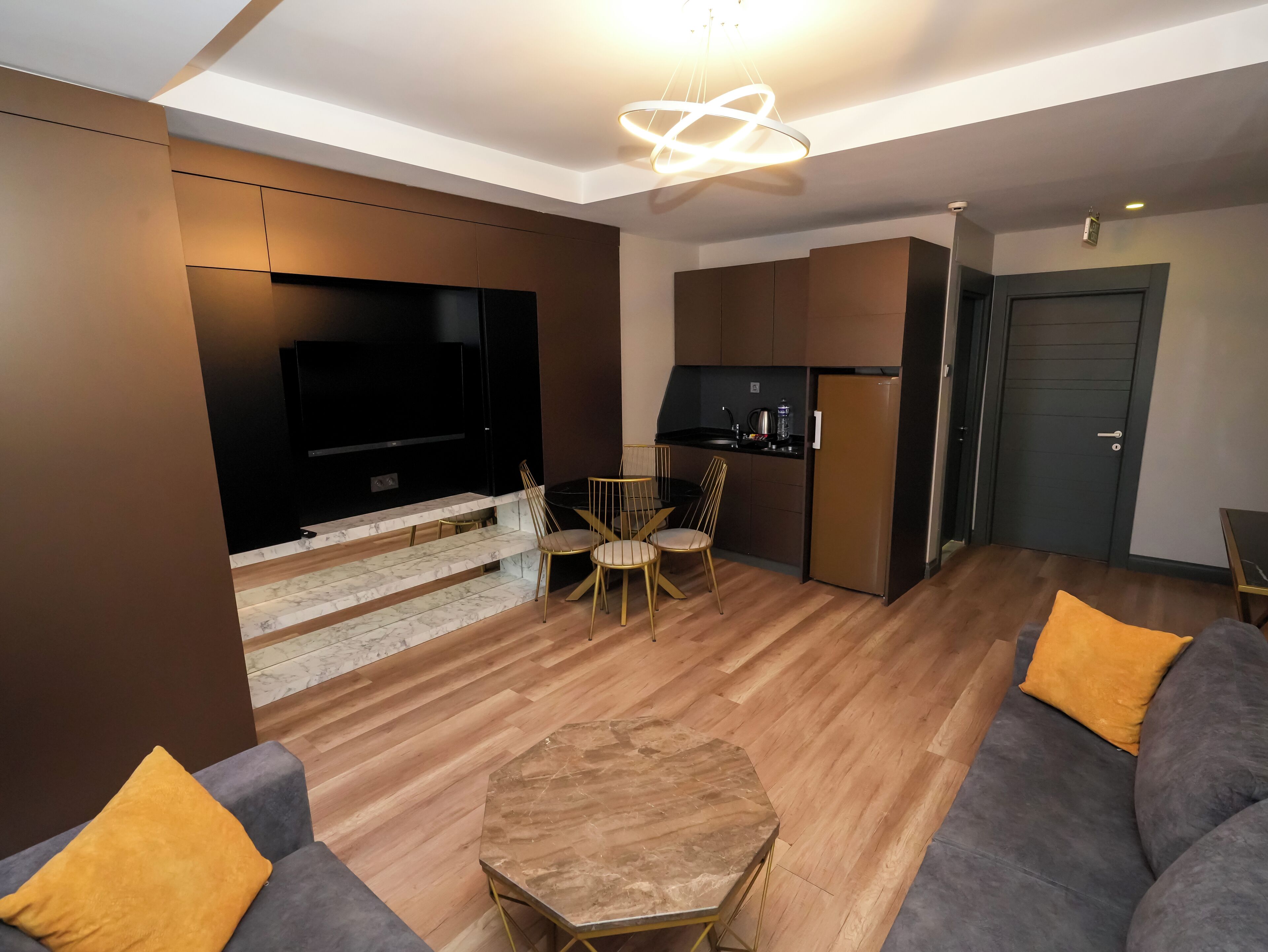 Deluxe Suite, 2 Bedrooms, Jetted Tub | Living area | 55-inch LCD TV with satellite channels, TV