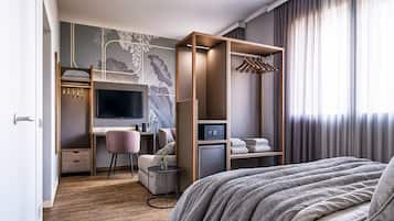 Suite | Una cassaforte in camera, tende oscuranti, lenzuola