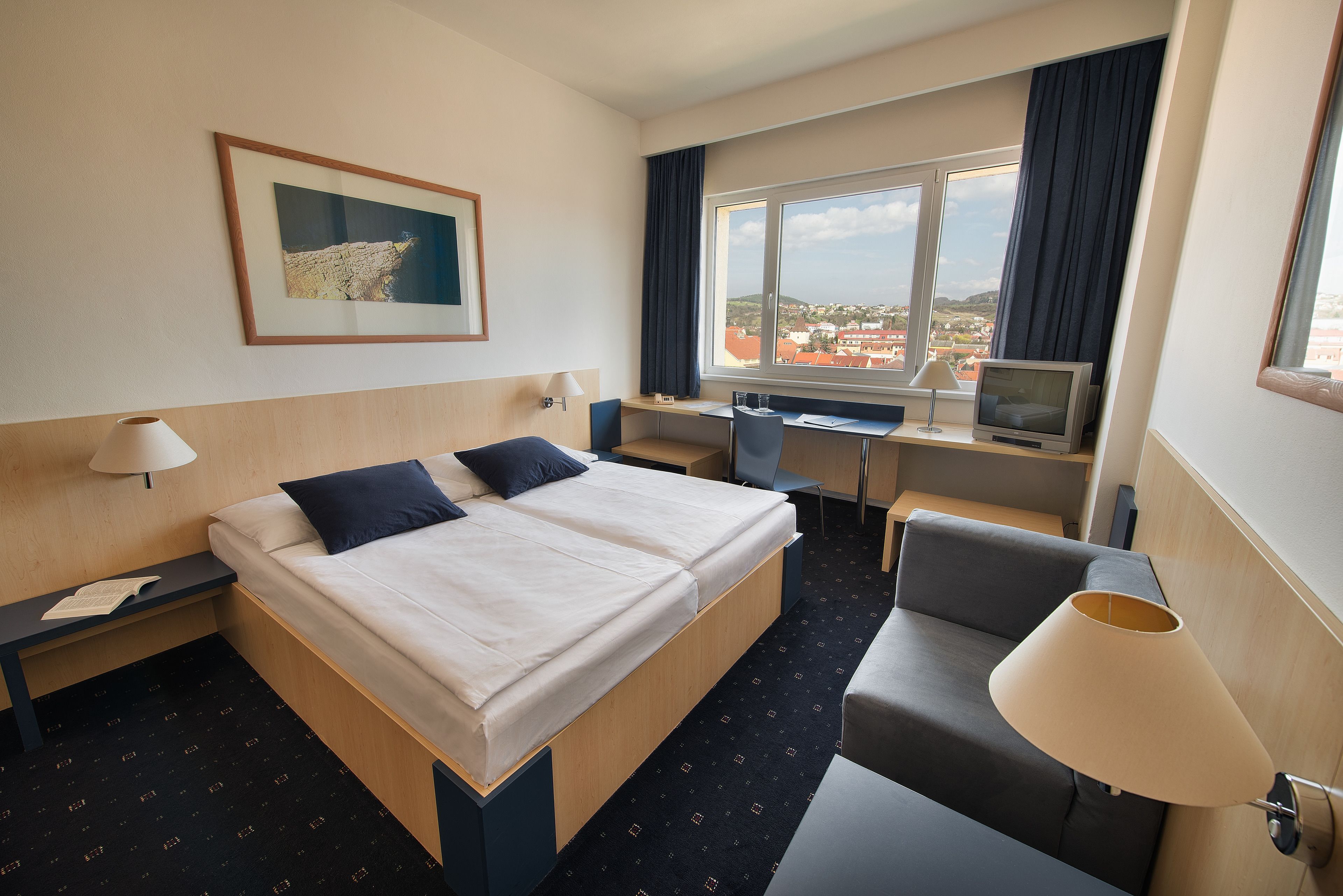 comfort double or twin room, city view | 1 bedroom, minibar, in-room safe, desk