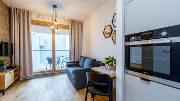 Superior Apartment | Living room | 40-inch flat-screen TV with cable channels, TV