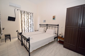 Double or Twin Room | 1 bedroom, blackout drapes, iron/ironing board, free WiFi