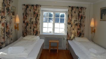 Desk, blackout curtains, iron/ironing board, bed sheets