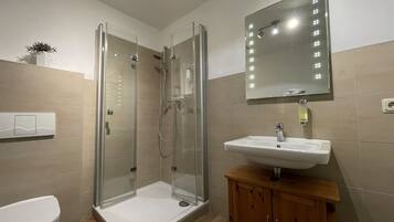 Deluxe Apartment, 1 Bedroom, Terrace, City View (Number 01) | Bathroom | Shower, hair dryer, towels, toilet paper
