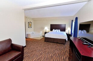 Premium bedding, desk, laptop workspace, blackout drapes