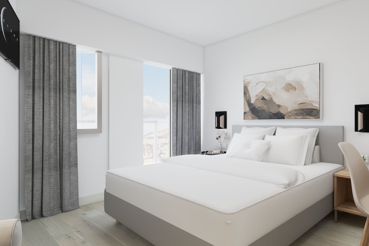 Suite Deluxe | Minibar, caja fuerte, escritorio y cortinas opacas