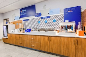 A breakfast bar with various food options and signage for Express Start Breakfast.