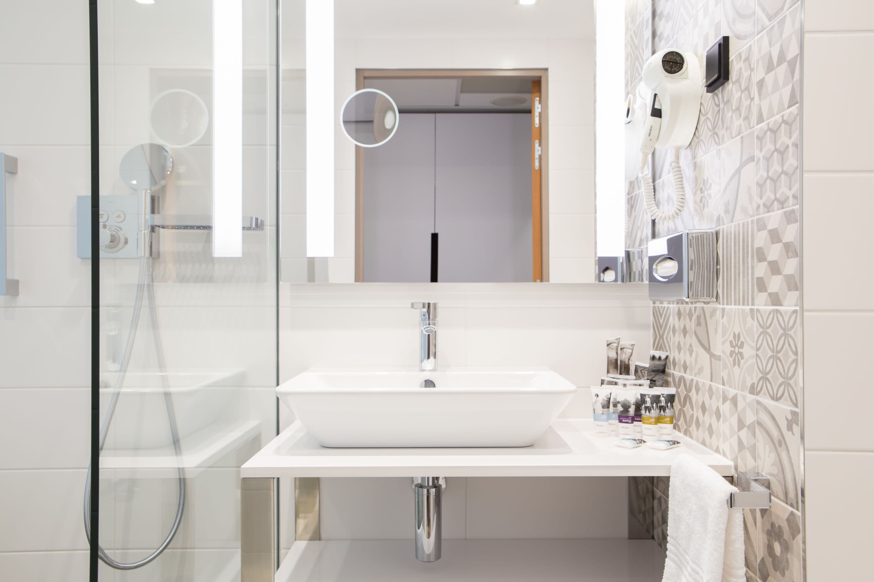 eco-friendly toiletries, hair dryer, towels