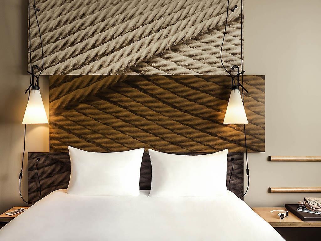 Premium bedding, desk, laptop workspace, blackout curtains