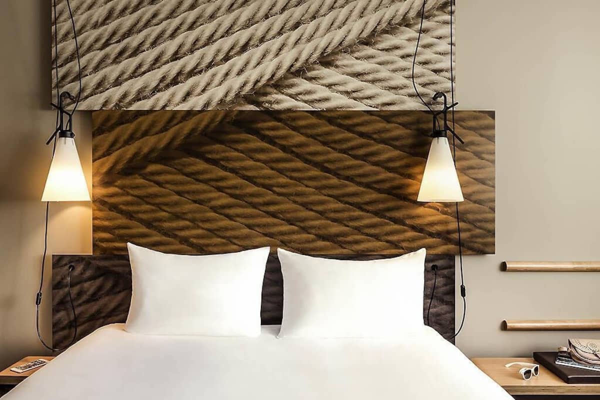 Premium bedding, desk, laptop workspace, blackout drapes