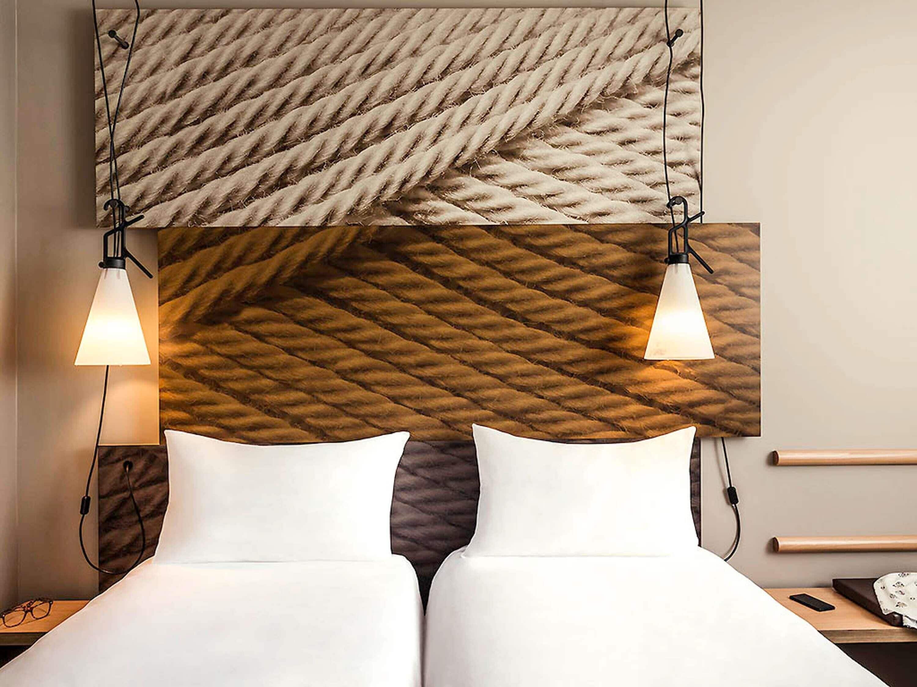 Premium bedding, desk, laptop workspace, blackout drapes