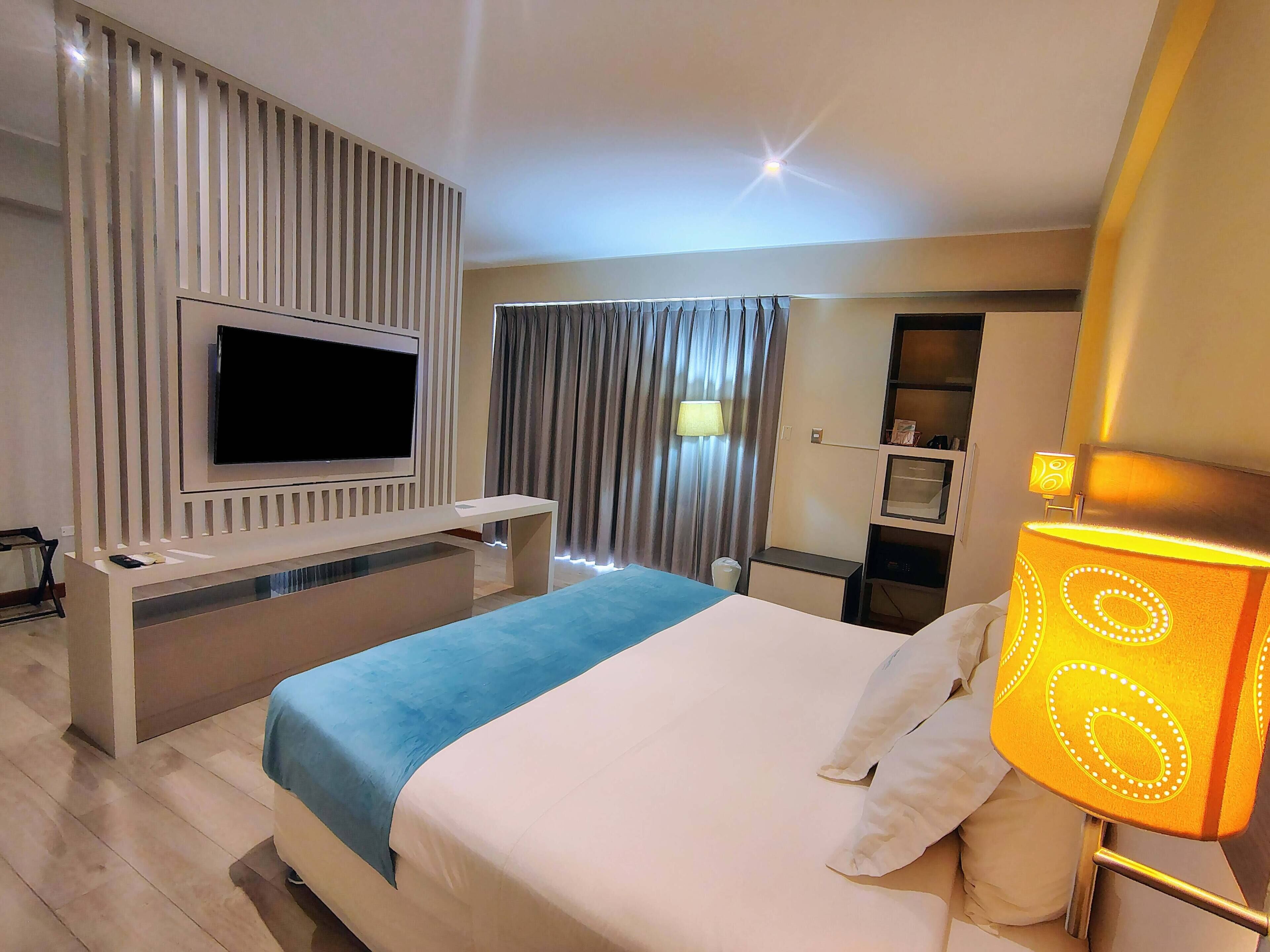 Superior Suite, 1 King Bed, Balcony | Minibar, in-room safe, desk, laptop workspace