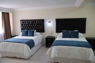 Habitación superior | Ropa de cama de alta calidad y edredones de plumas