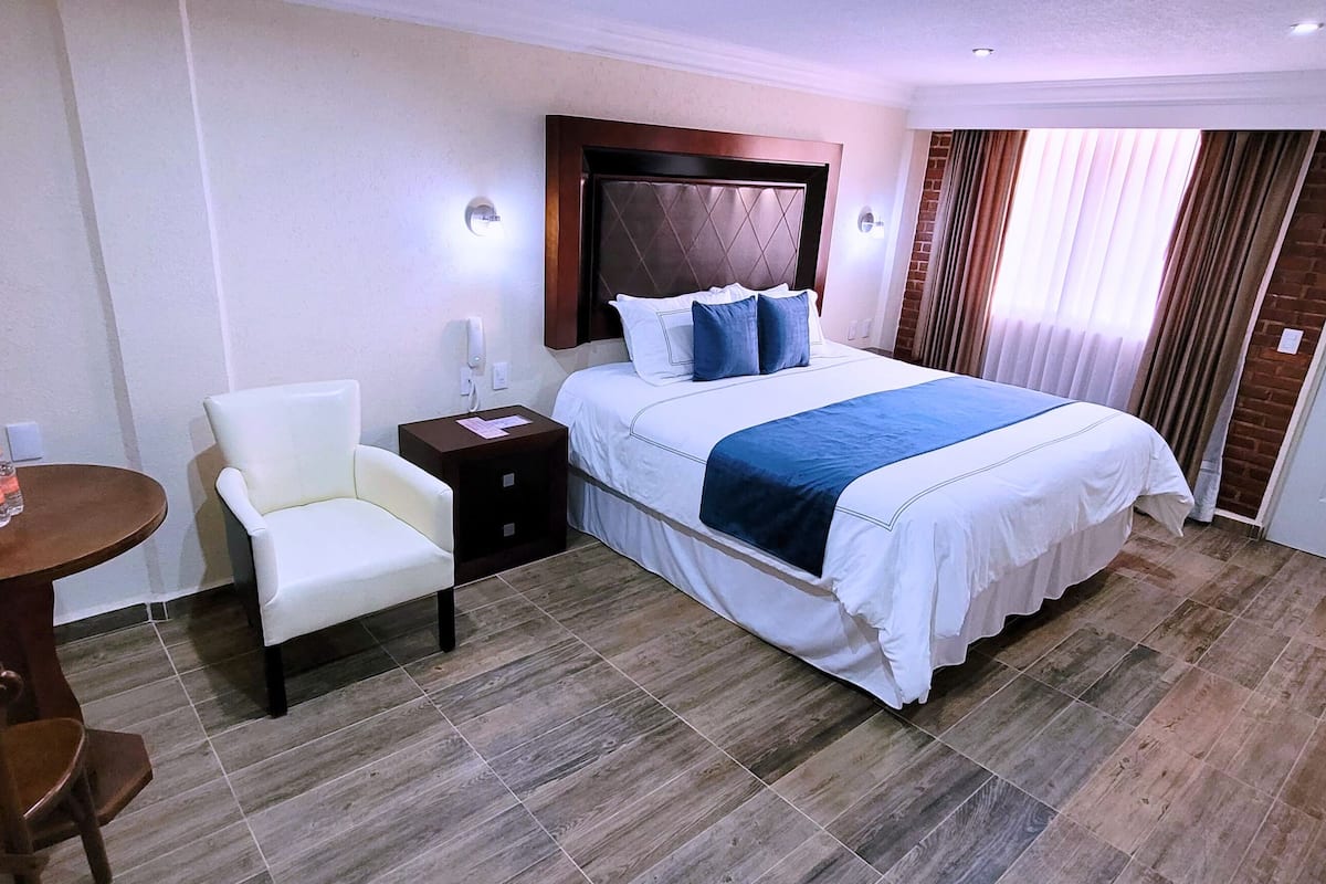 Deluxe Room | Peralatan tempat tidur premium, gebar bulu kapas